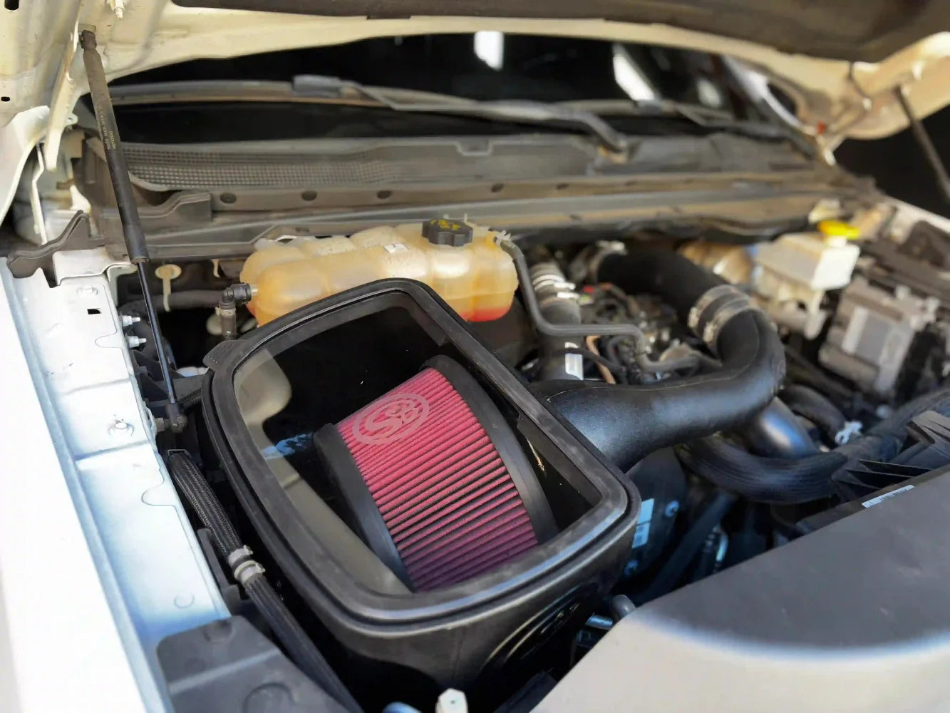 Cold Air Intake for the 2020-2023 Dodge Ram 1500 3.0L EcoDiesel installed in the engine compartment of a vehicle