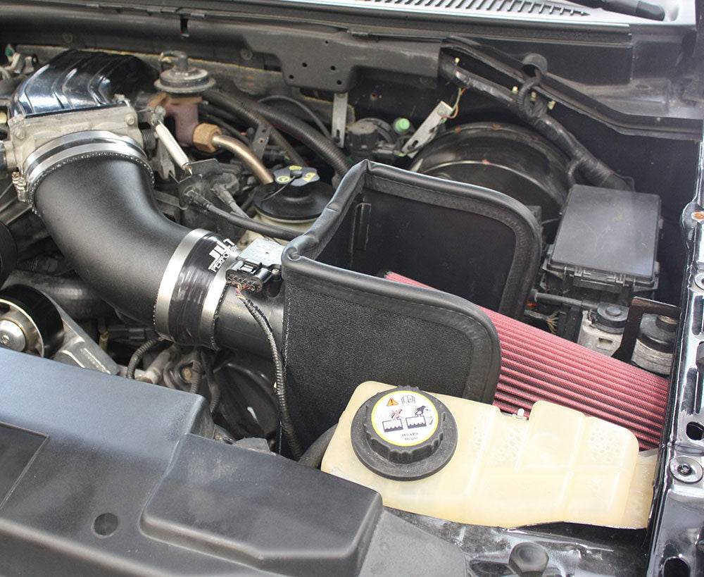 JLT BIG Air Intake for 1999-2004 F-150 Lightning & 2002-2003 F-150 Harley - S&B installed in the engine compartment of a vehicle