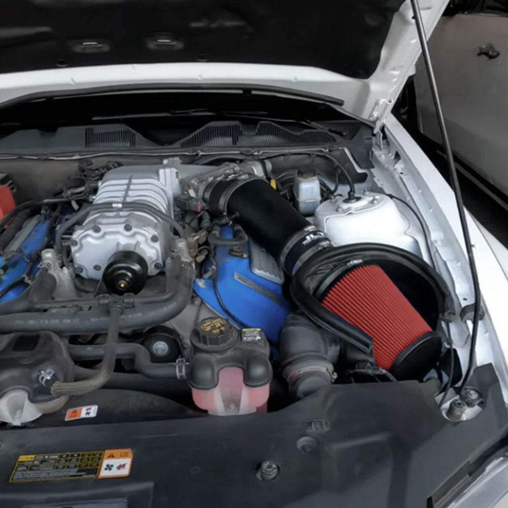 JLT Induction Kit for 2010-2014 Mustang GT500 - S&B installed in the engine compartment of a vehicle