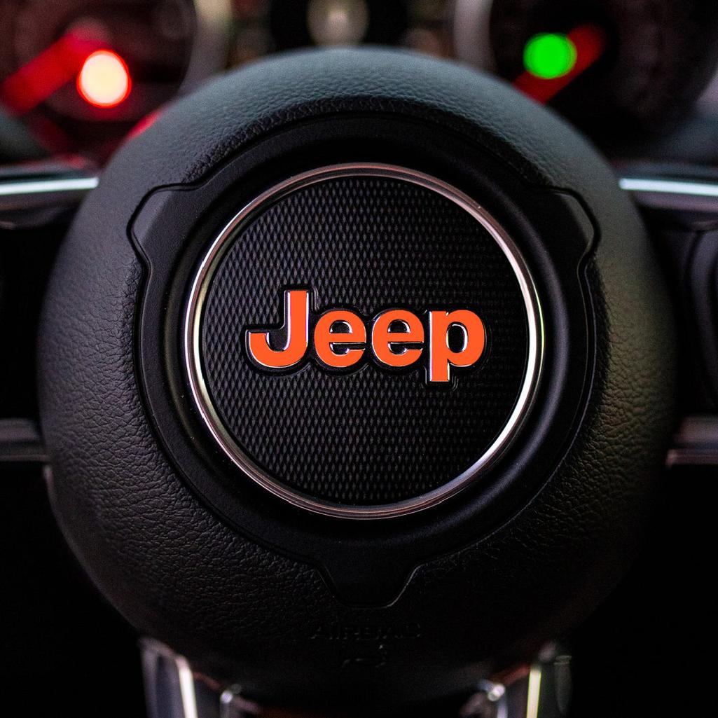 Steering wheel with Jeep logo in a car interior