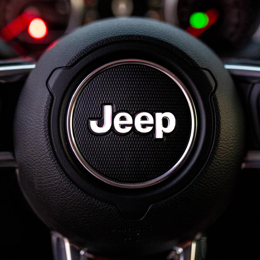 Steering wheel with Jeep logo in a car interior