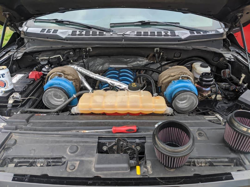 Two SB Volocity Stacks installed in a car hood to keep large debris from entering the turbo/engine