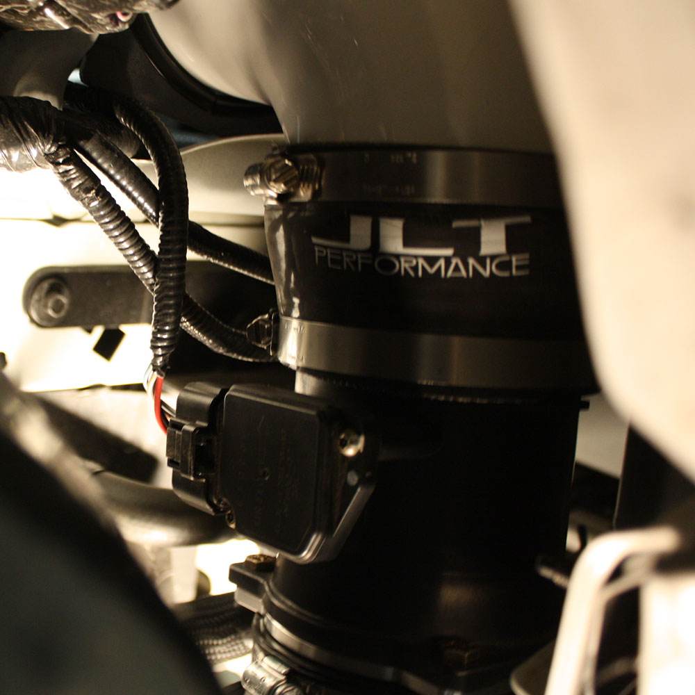 Close up JLT Cold Air Intake Kit for 2003-2004 SVT Cobra - S&B installed in the engine compartment of a vehicle
